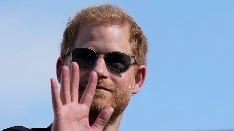 Britain's Prince Harry, the Duke of Sussex, waves during the...