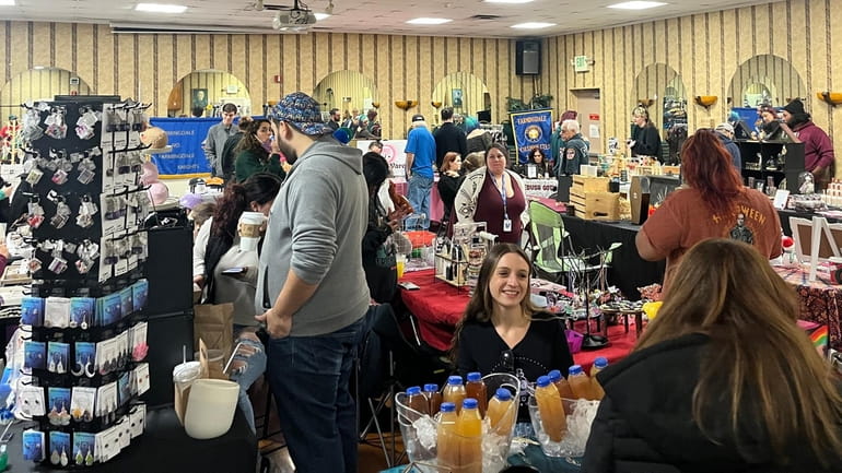 Shoppers browse the booths at the NYSF Indoor Spring Equinox...