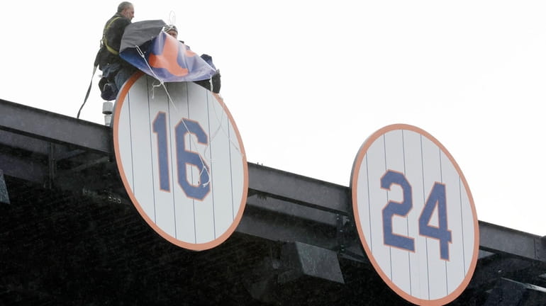 Dwight Gooden's No. 16 is unveiled during a pregame ceremony...