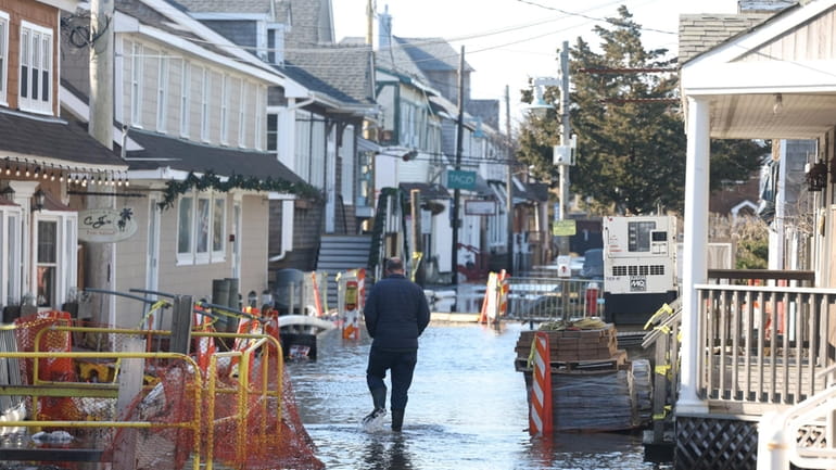 Ocean Beach in Fire Island is flooded after a January...