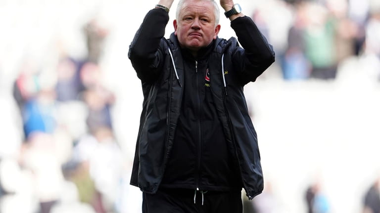 Sheffield United's head coach Chris Wilder applauds the fans after...