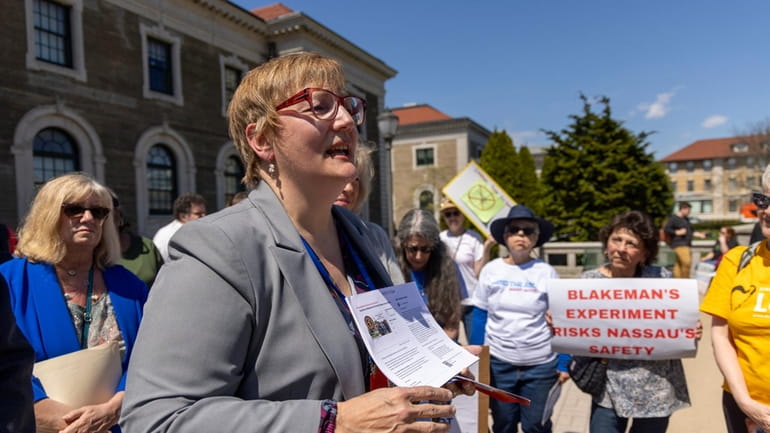 Sabine Margolis along with other advocates and residents gathered Monday outside...