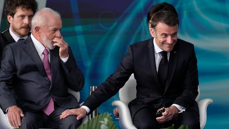 France's President Emmanuel Macron, right, and Brazilian President Luiz Inacio...