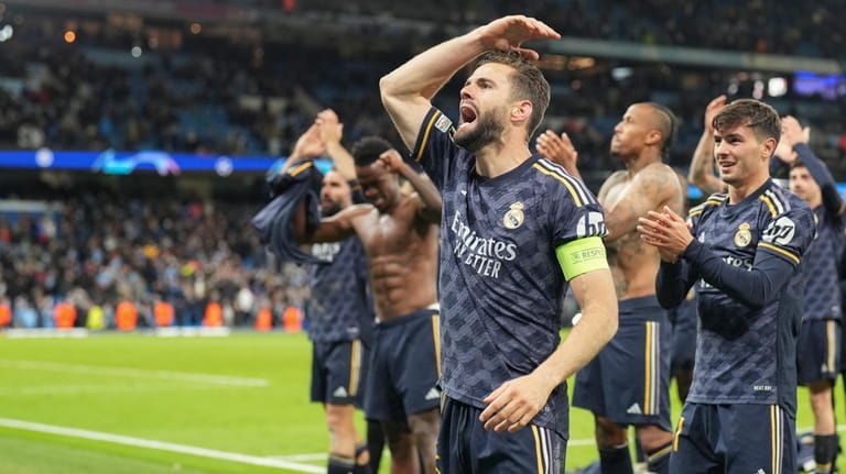 Real Madrid's Nacho celebrates victory in front of their fans...