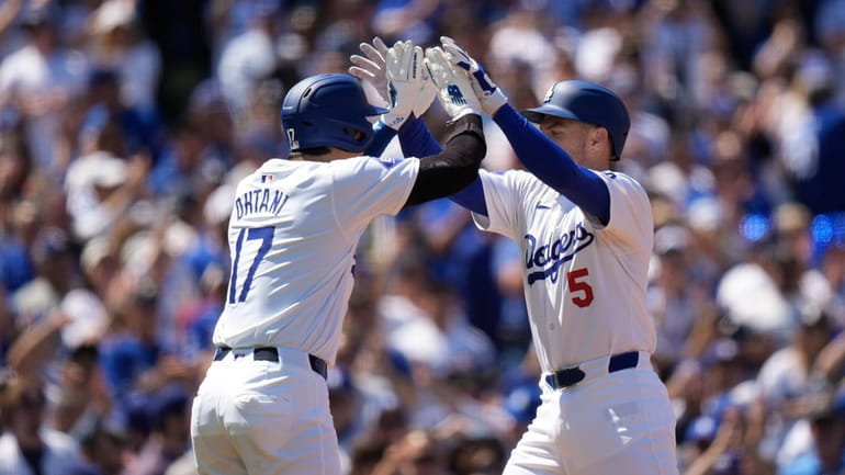 Los Angeles Dodgers' Freddie Freeman (5) celebrates his two-run home...