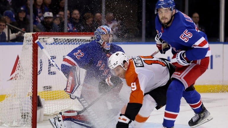 New York Rangers defenseman Ryan Lindgren (55) hits Philadelphia Flyers...