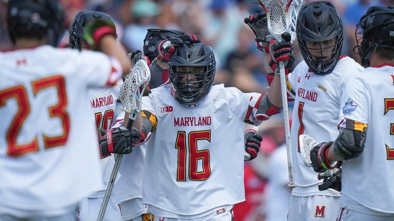 Maryland attack Anthony DeMaio (16) celebrates his goal against Cornell...