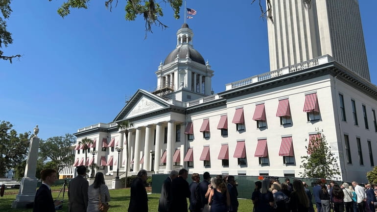 Mourners line up outside the historic Old Capitol building in...