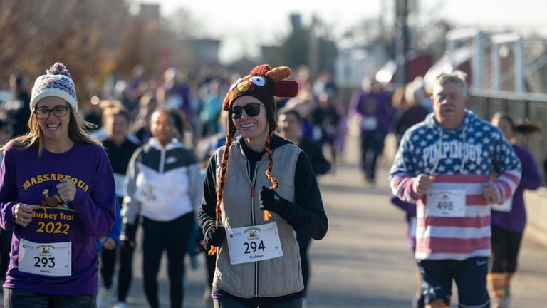 Runners participate in the Massapequa Thanksgiving Day Turkey Trot 5K...