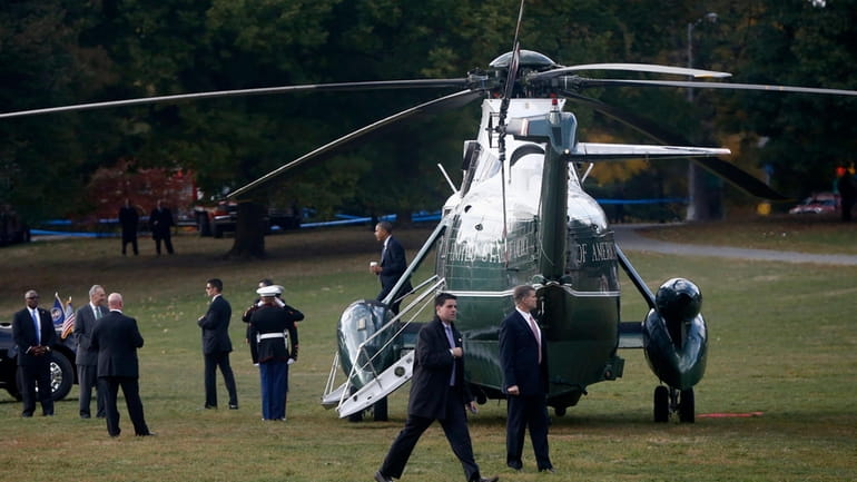 President Barack Obama steps off the Marine One helicopter as...