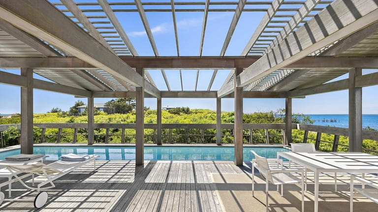 The pool house stands between Bay and Ocean houses and...