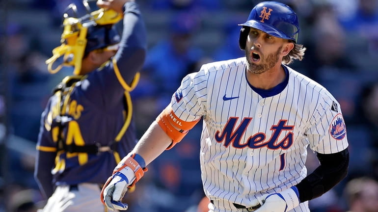 Jeff McNeil #1 of the Mets reacts after flying out...