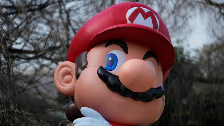 This photo shows a balloon of the Mario character of...