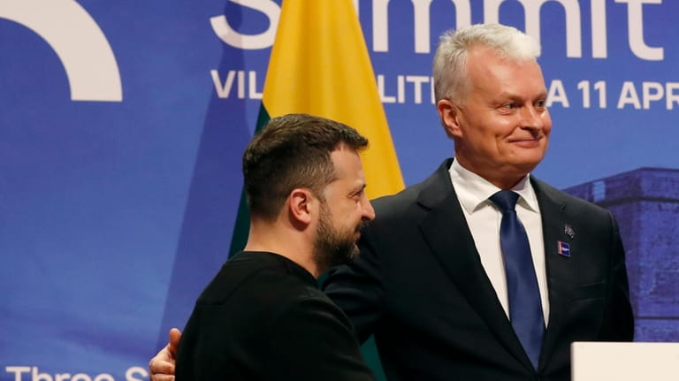 Ukraine's President Volodymyr Zelenskyy, left, stands with Lithuania's President Gitanas...