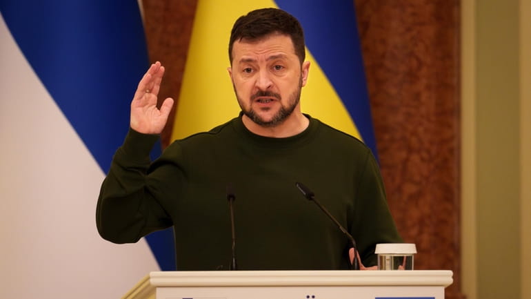 Ukraine's President Volodymyr Zelenskyy gestures during a press conference in...