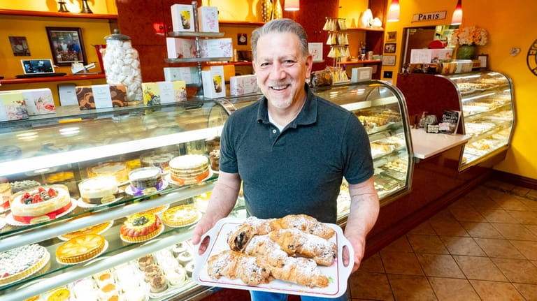 Fiorello Dolce owner Gerard Fioravanti holds a tray of crookies...