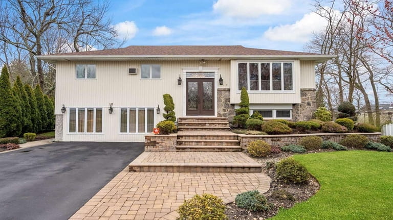 This nearly $1.5 million Old Bethpage home is a legal...