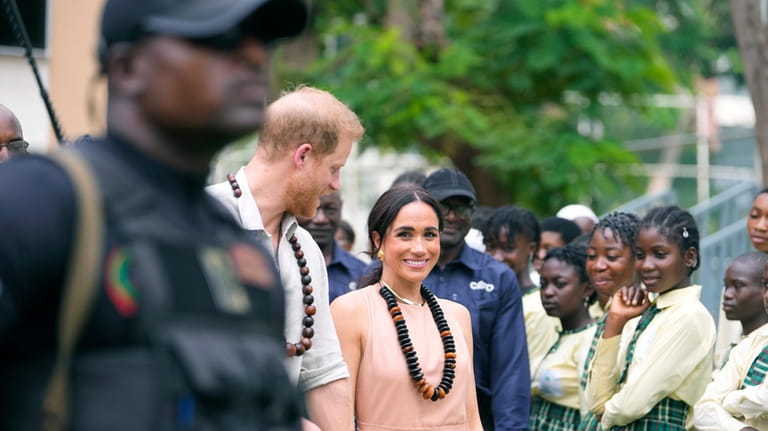 Prince Harry and Meghan visit children at the Lights Academy...