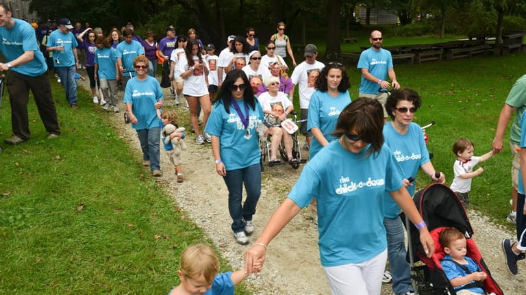 Families and friends walk together in the "5k Walk to...