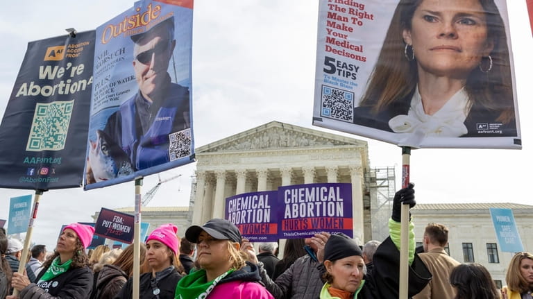 Anti-abortion and Abortion-rights activists rally outside the Supreme Court, Tuesday,...