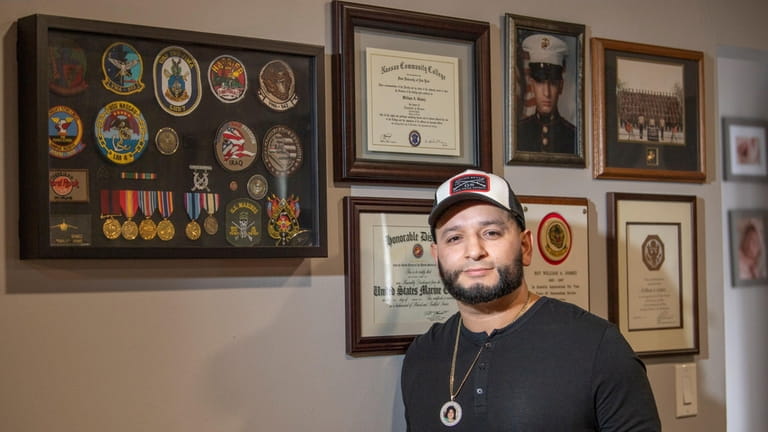 William Gomez, who served in the Marine Corps, at his house...