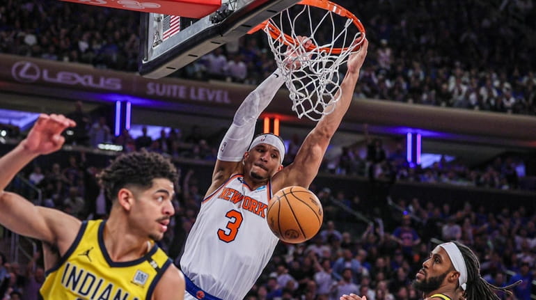 Knicks’ Josh Hart dunks the ball while the Indiana Pacers’...