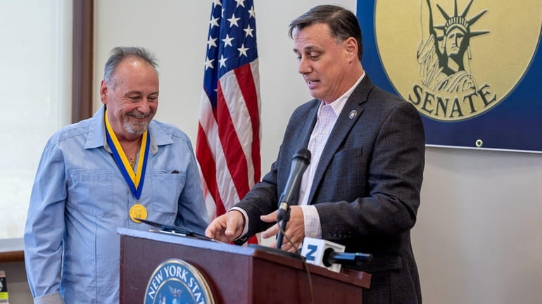 Bill Gorga receives a Liberty Award from State Sen. Anthony Palumbo...