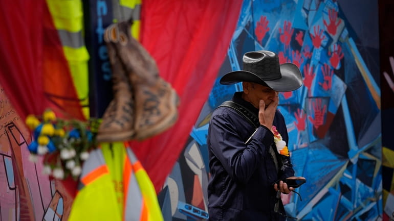 Roberto Marquez, an artist from Dallas, speaks during an interview...