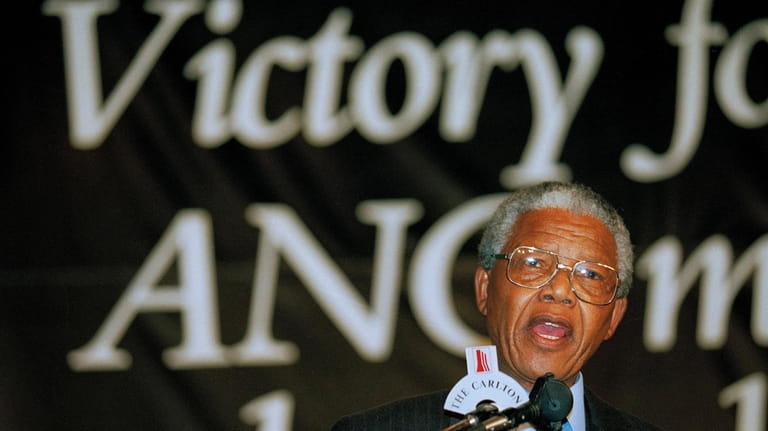 FILE — Nelson Mandela addresses supporters during victory celebrations in...