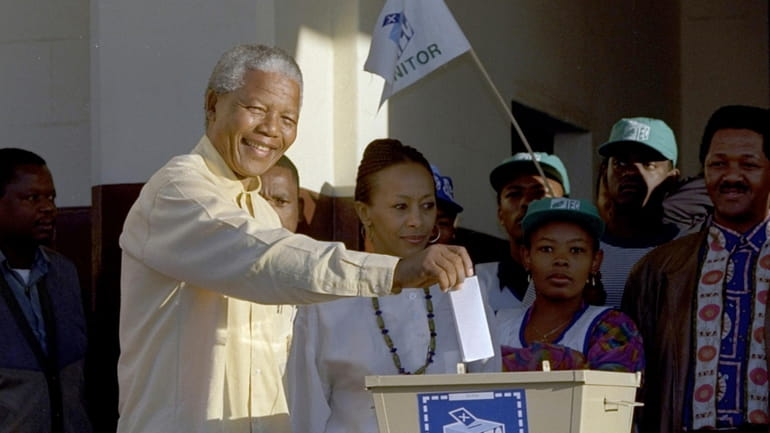 Then African National Congress leader, Nelson Mandela casts his vote...