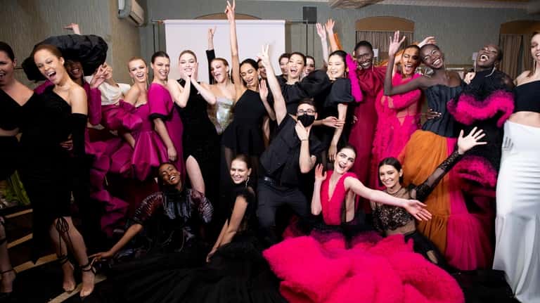 Designer Christian Siriano, in black mask, with his models.
