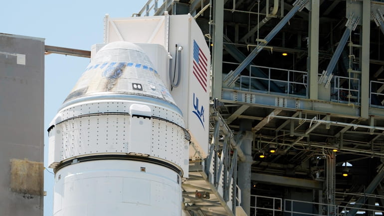 Boeing's Starliner capsule atop an Atlas V rocket is seen...