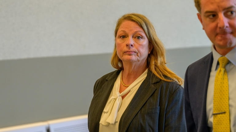 Ann Marie Drago leaves Suffolk County Court in Riverhead last week...
