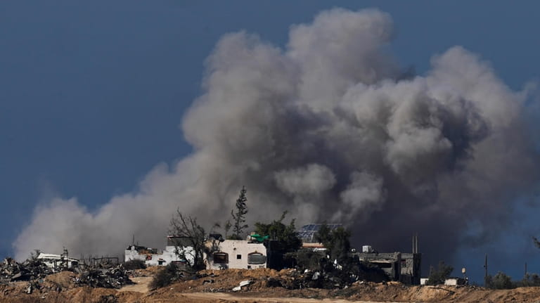 Smoke rises following an Israeli bombardment in the Gaza Strip,...