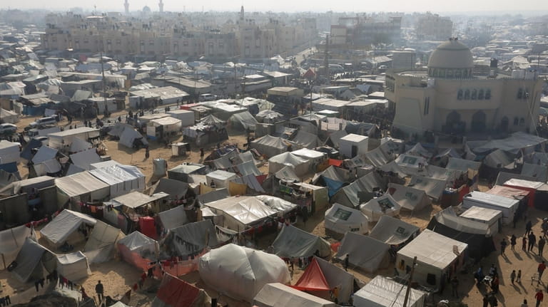 A view of the makeshift tent camp where Palestinians displaced...