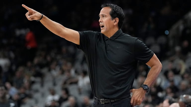 Miami Heat head coach Erik Spoelstra directs players during the...
