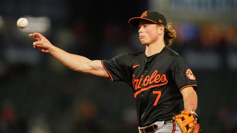 Baltimore Orioles second baseman Jackson Holliday throws out Los Angeles...