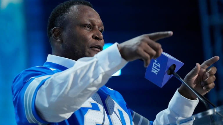 Former player Barry Sanders speaks during a draft announcement for...