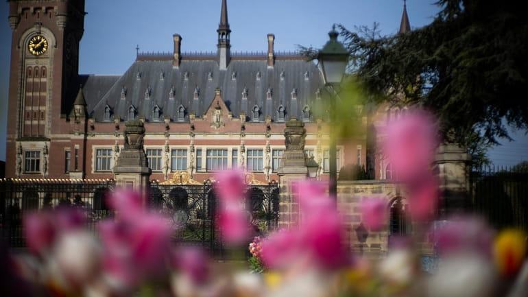 Tulips flower outside the Peace Palace housing the World Court,...
