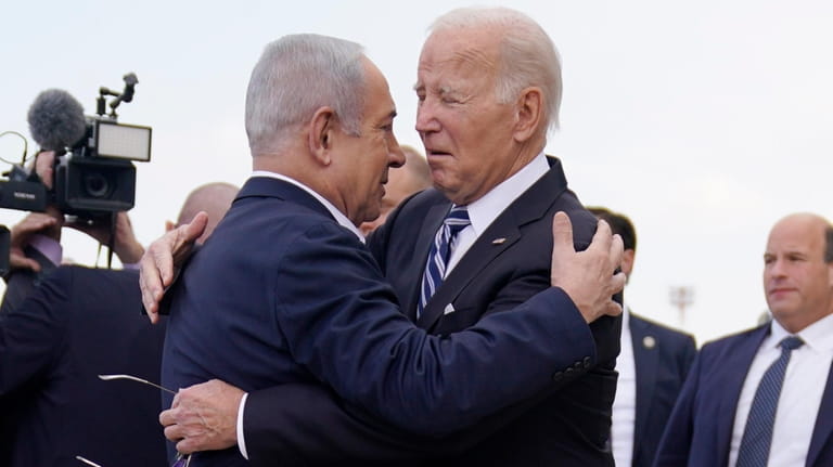 President Joe Biden is greeted by Israeli Prime Minister Benjamin...