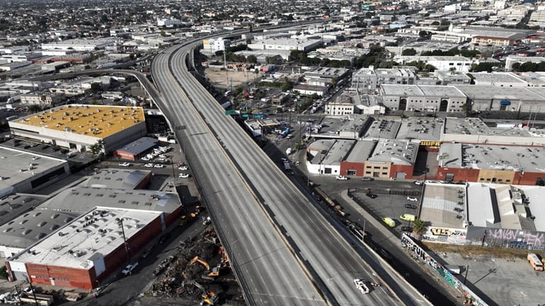 In this aerial view, Interstate 10 is empty due to...