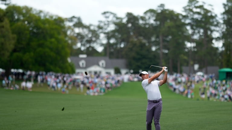Rory McIlroy, of Northern Ireland, hits from the fairway on...