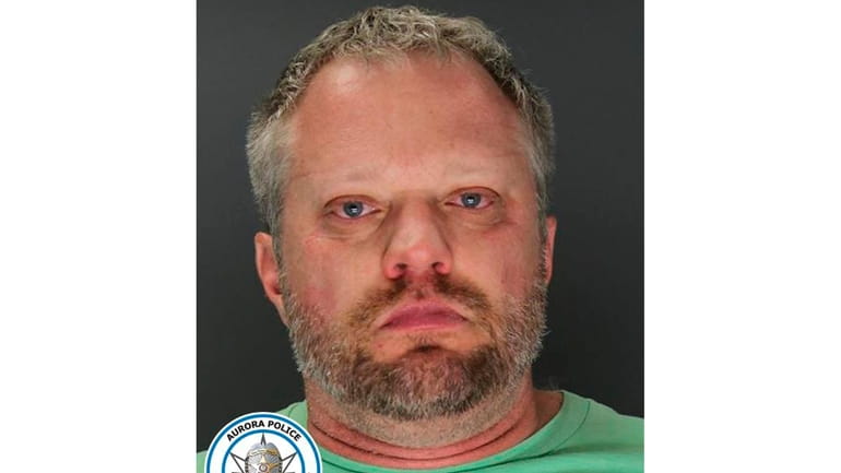 This undated booking photo provided by the Aurora, Colo., Police...