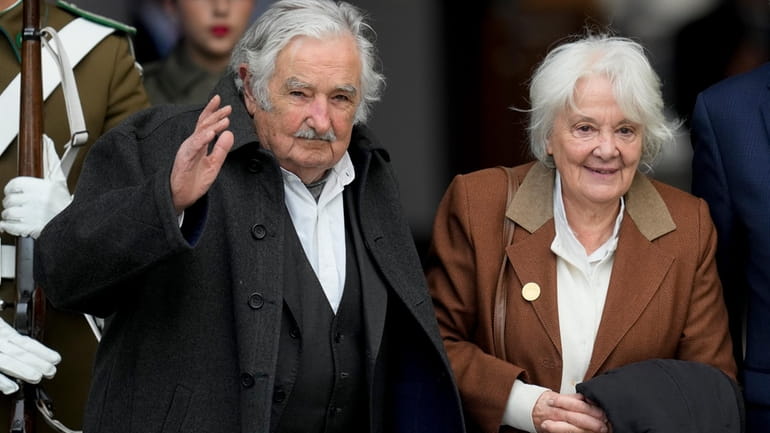 Uruguay's former President Jose Mujica, left, and his wife Lucia...