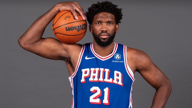 The 76ers' Joel Embiid poses for a photograph during media...