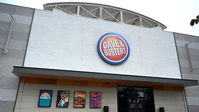 Customers at the Dave & Buster's in Westbury and each of...