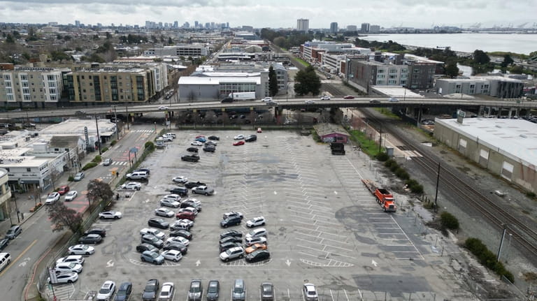 An aerial view shows a parking lot that was once...