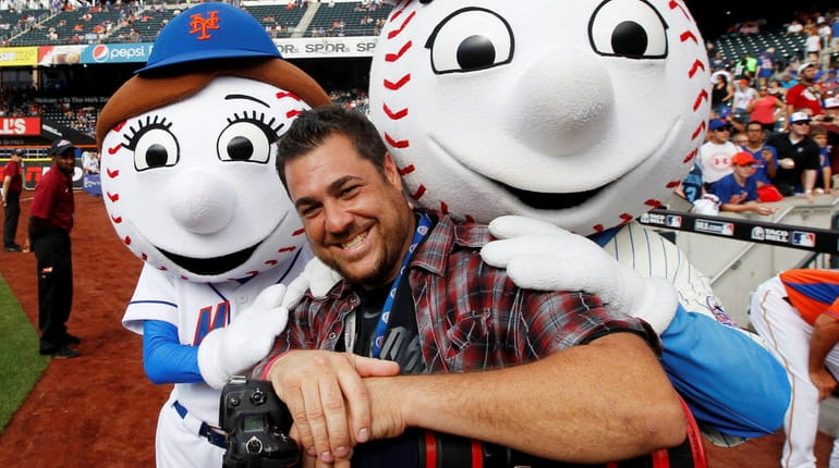 New York Post sports photographer Anthony Causi shares a moment with Mr....