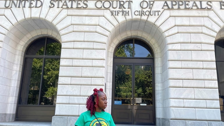 Teliah Perkins stands in front of the federal appeals court...