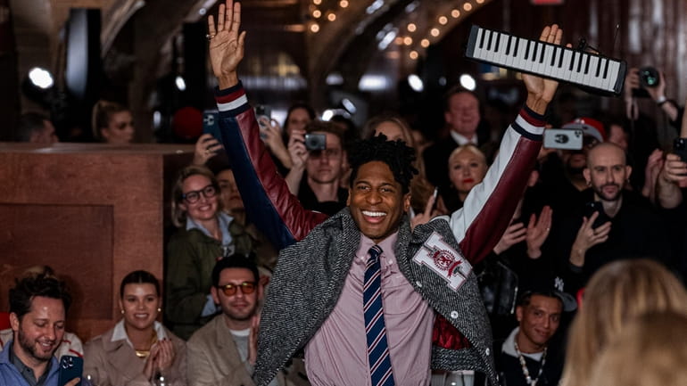 Musician Jon Batiste, center, performs at the Tommy Hilfiger runway...